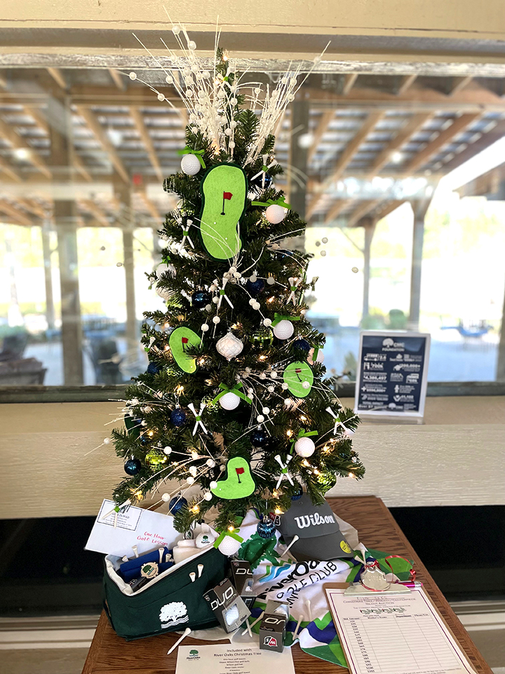 This tree comes with a 1 hour golf lesson, a dozen Wilson Duo golf balls, a Wilson golf hat, a River Oaks golf towel, mini cooler, and more!